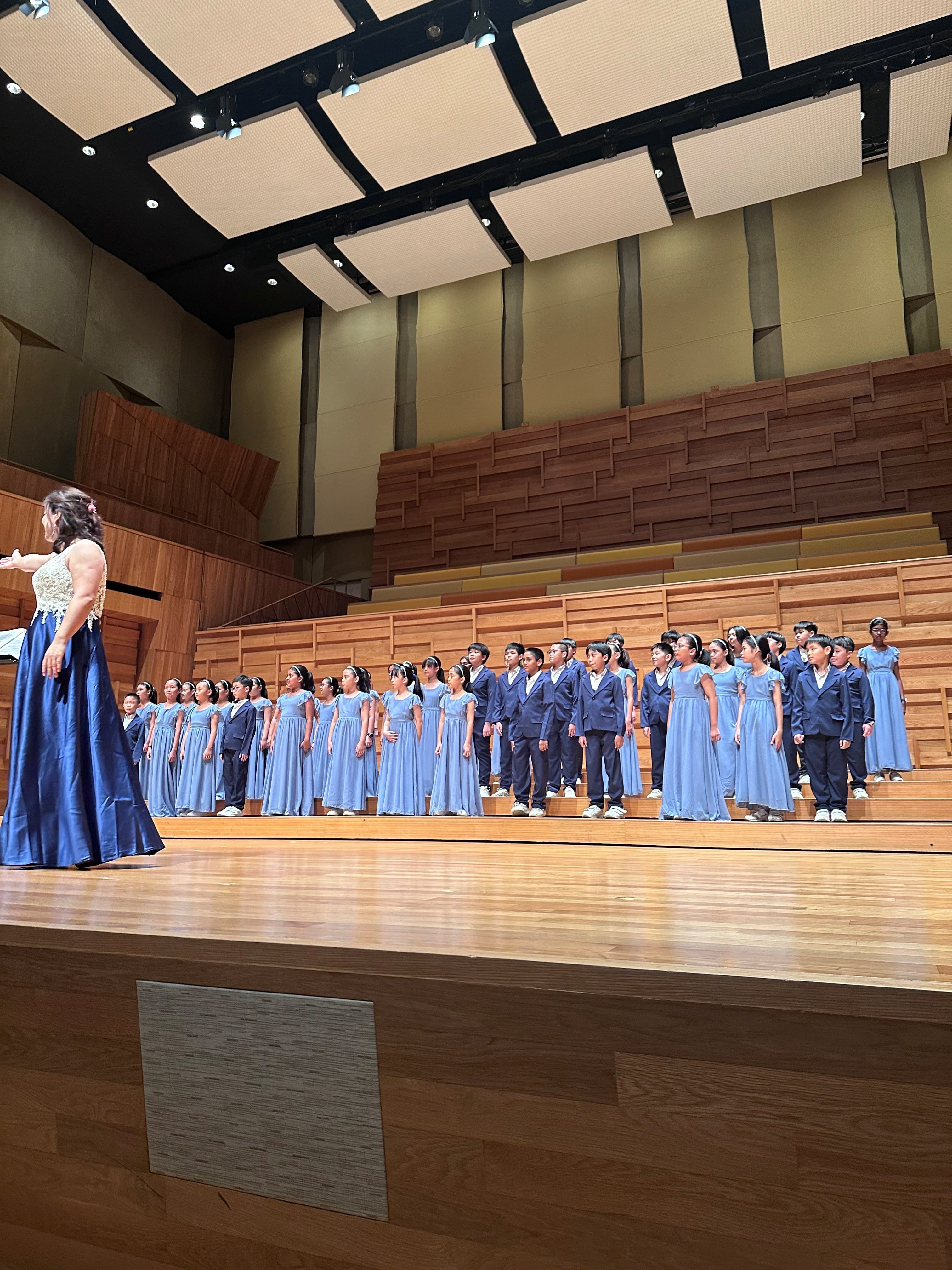 Choir students performing on stage
